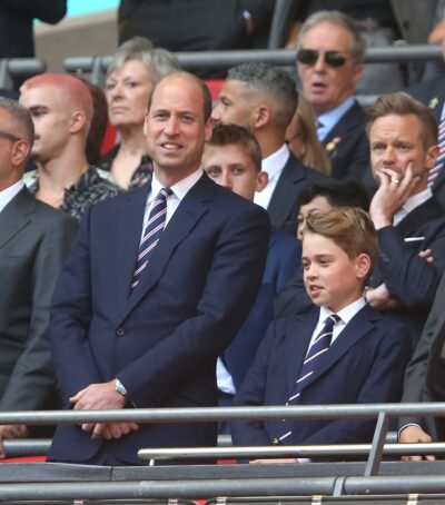 Prince William and Prince George in the stands at the footbakll